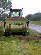 Tractor working on maintaining a road verge