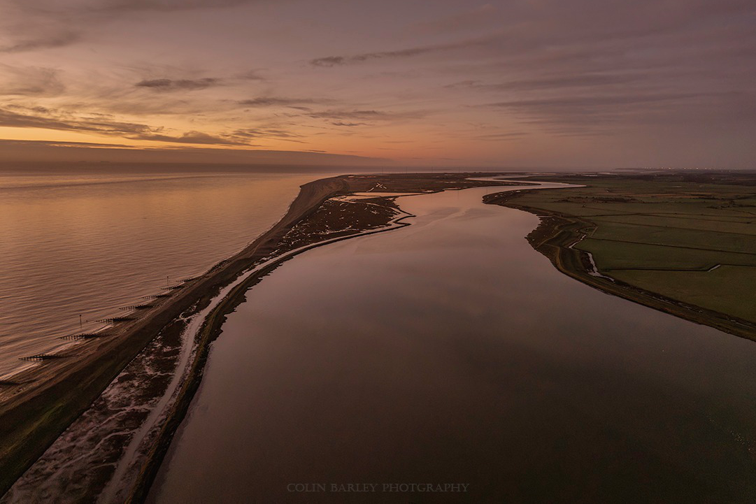 A golden sunrise over the rivers Alde and Ore